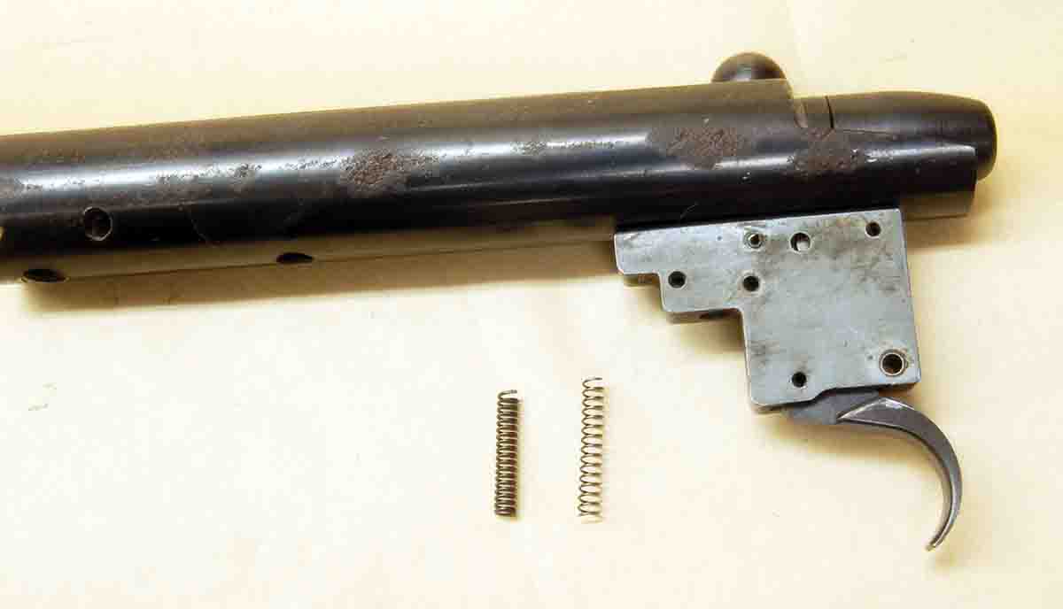 The factory trigger-return spring (left) and its lighter replacement (right). Specifications are given in the column.